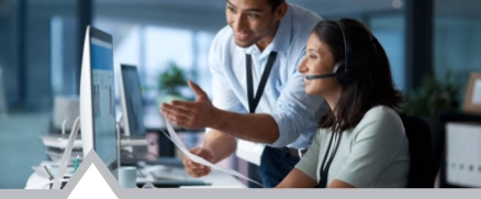 Man helping give woman IT support help