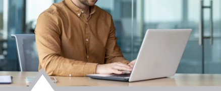 male programmer using laptop to remotely work